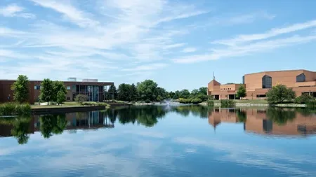 Campus buildings and lake.